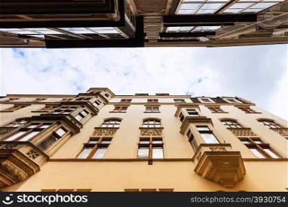 travel to Vienna city - facades of apartment houses on narrow street in Vienna (Annagasse), Austria