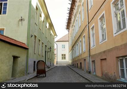 travel, tourism and european architecture concept - old town street with abandoned gig in tallinn city in estonia. old city street with abandoned gig