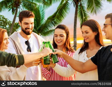 travel, tourism and friendship concept - group of happy friends toasting non alcoholic drinks over tropical beach background in french polynesia. friends toasting non alcoholic drinks on beach