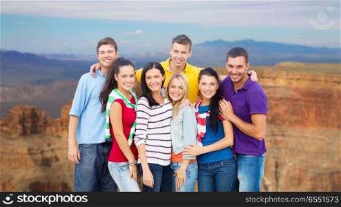 travel, tourism and people concept - group of happy friends over grand canyon national park background. group of happy friends over grand canyon. group of happy friends over grand canyon