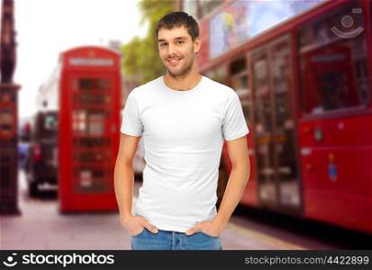 travel, tourism and people concept - handsome man in blank white t-shirt over london city street background