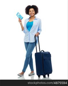 travel, tourism and people concept - smiling young woman with airplane ticket and bag