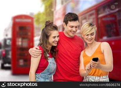 travel, tourism and summer holidays concept - group of happy smiling friends with smartphone over london city street background. friends with smartphone over london city street