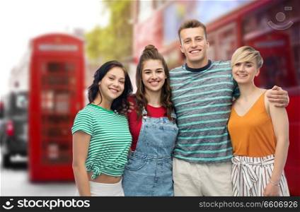 travel, tourism and summer holidays concept - group of happy smiling friends hugging over london city street background. happy friends over london city street background