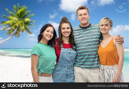 travel, tourism and summer holidays concept - group of happy smiling friends hugging over exotic tropical beach background. happy friends hugging over beach background