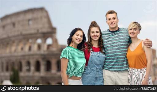travel, tourism and summer holidays concept - group of happy smiling friends hugging over coliseum background. happy friends hugging over coliseum background