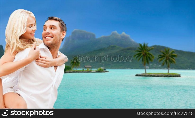 travel, tourism and summer holidays concept - happy couple having fun at touristic resort over exotic bora bora island background. happy couple over bora bora background. happy couple over bora bora background