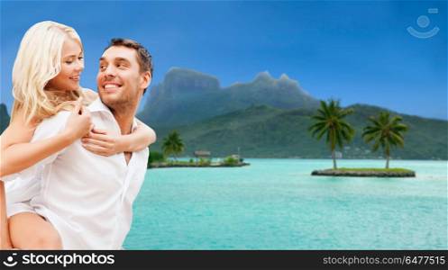travel, tourism and summer holidays concept - happy couple having fun at touristic resort over exotic bora bora island background. happy couple over bora bora background. happy couple over bora bora background