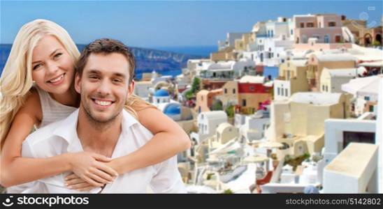 travel, tourism and summer holidays concept - happy couple hugging over santorini island background. happy couple hugging over santorini island
