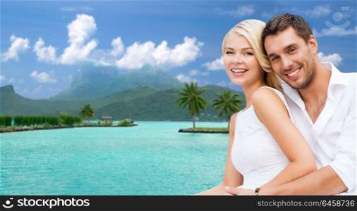 travel, tourism and summer holidays concept - happy couple in sunglasses at touristic resort over exotic bora bora island background. happy couple on over bora bora background