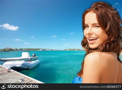 travel, tourism and summer vacation concept - beautiful winking woman over wooden pier and boat on tropical beach background in french polynesia. beautiful winking woman on beach