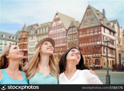 travel, tourism and summer vacation concept - group of happy smiling women or friends over frankfurt am main city background. happy women over frankfurt am main background
