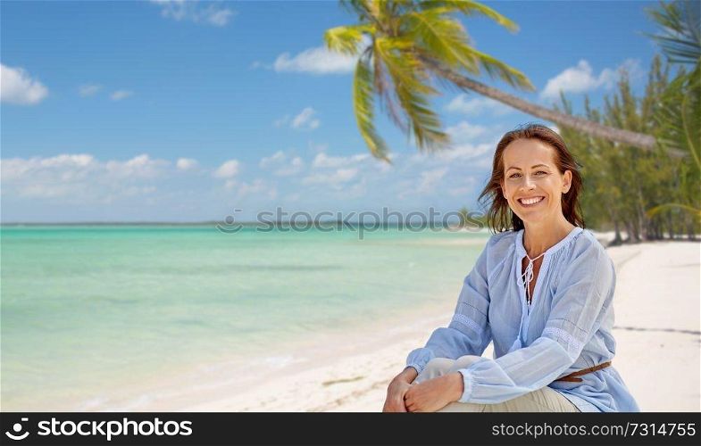 travel, tourism and summer vacation concept - happy smiling woman over tropical beach background in french polynesia. happy woman over tropical beach background