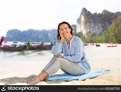 travel, tourism and vacation concept - happy smiling woman over tropical beach background in french polynesia. happy smiling woman on summer beach