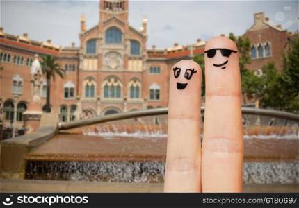 travel, tourism, couple, people and body parts concept - close up of two fingers with smiley faces