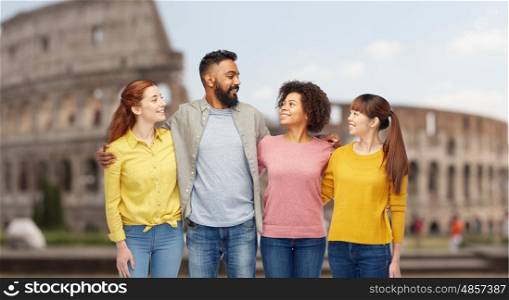 travel, tourism, diversity and people concept - international group of happy smiling men and women over coliseum background