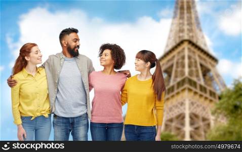 travel, tourism, diversity and people concept - international group of happy smiling men and women over eiffel tower background. international group of happy smiling people