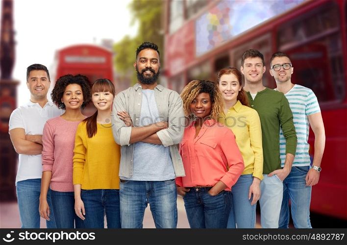 travel, tourism, diversity, ethnicity and people concept - international group of happy smiling men and women over london city street background