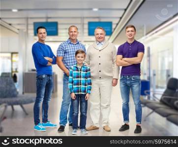 travel, tourism, gender, generation and people concept - group of smiling men and boy over airport waiting room background