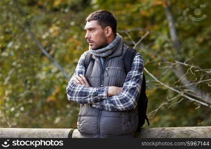 travel, tourism, hike and people concept - man with backpack outdoors