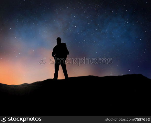 travel, tourism, hike and people concept - silhouette of traveler standing on edge of mountain over starry night sky or space background. traveler standing on edge over night sky