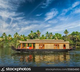 Travel tourism Kerala background - houseboat on Kerala backwaters. Kerala, India