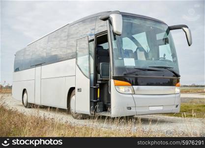 travel, tourism, road trip and passenger transport - tour bus staying outdoors