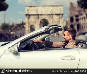 travel, tourism, road trip, transport and people concept - happy man driving cabriolet car over triumphal arch in city of rome background