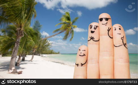 travel, tourism, summer vacation, people and body parts concept - close up of fingers family with smiley faces over exotic tropical beach with palm trees background