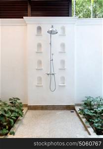 travel, tourism, vacation and summer holidays concept - outdoor shower at exotic hotel. outdoor shower at exotic hotel