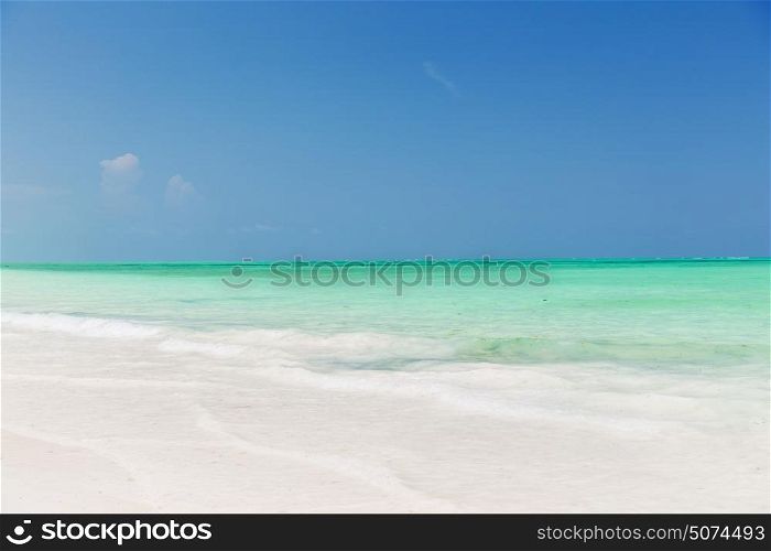 travel, tourism, vacation and summer holidays concept - sea and sky on exotic tropical beach. sea and sky on exotic tropical beach