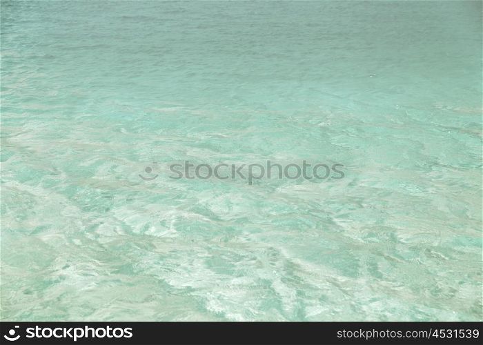 travel, tourism, vacation and summer holidays concept - sea or ocean blue transparent water