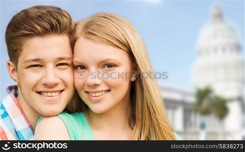 travel, tourism, vacation, people and love concept - smiling couple hugging over washington white house background