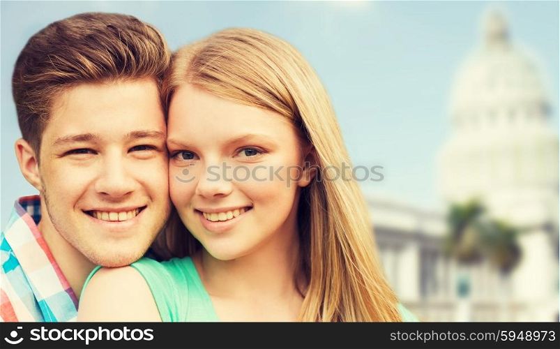 travel, tourism, vacation, people and love concept - smiling couple hugging over washington white house background