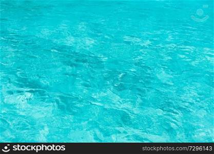 travel, vacation and background concept - blue water in pool, sea or ocean. blue water in pool, sea or ocean