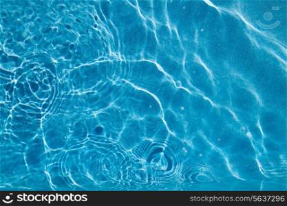 travel, vacation and background concept - water in pool, sea or ocean