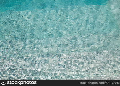 travel, vacation and background concept - water in pool, sea or ocean