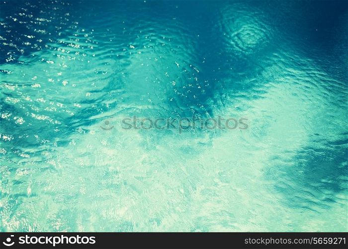 travel, vacation and background concept - water in pool, sea or ocean