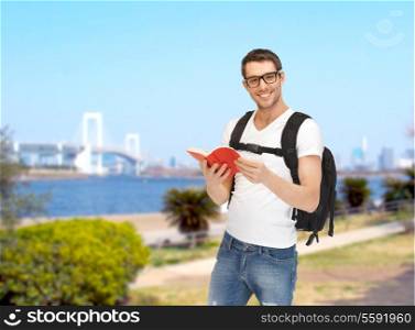 travel, vacation and education concept - travelling student with backpack and book