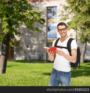 travel, vacation and education concept - travelling student with backpack and book