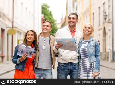 travel, vacation and friendship concept - group of smiling friends with city guide and map exploring city