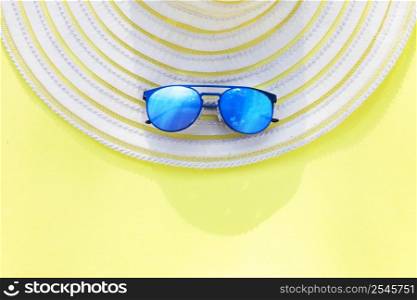 Travel vacation background. Sun glasses hat bright yellow background. Concept summer holidays.. Travel vacation background. Sun glasses yellow background. Concept summer holidays.