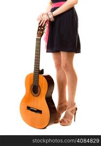 Travel vacation concept. Music lover summer girl holding acoustic guitar isolated on white