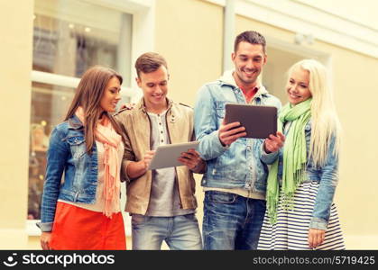 travel, vacation, technology and friendship concept - group of smiling friends with tablet pc computers in the city