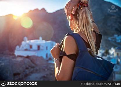 Traveler girl enjoying mountainous city view in bright sun light, interesting summer adventure, touristic place, active lifestyle