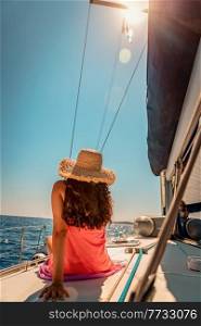 Traveler Girl with Pleasure Taking Sun Bath on the Sailboat. Luxury Summer Trip to Greece. Enjoying Holidays on the Yacht.. Woman Tanning on Sailboat