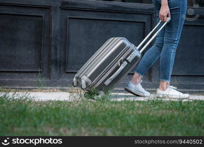 Traveler woman carrying luggage. Tourist walking with Suitcases Travel lifestyle concept