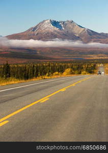 Travelers are provided with asphalt to travel Alaska wild places