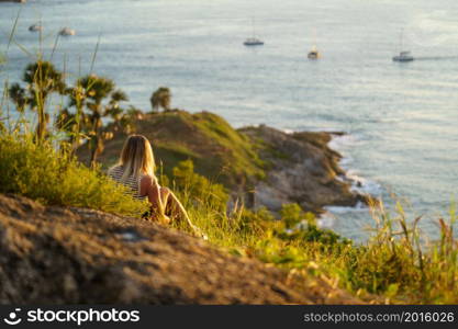 Travelers at Phromthep cape viewpoint at the south of Phuket Island, Thailand. Tropical paradise in Thailand. Phuket is a popular destination famous for tourists