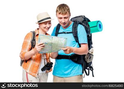 Travelers on a hike with a map and backpacks isolated